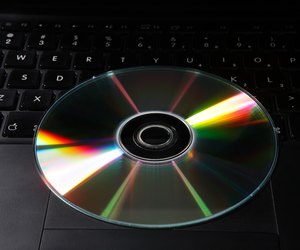 Top angle view of a CD and a laptop