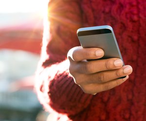 Hand typing on phone