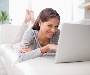 Woman on the sofa chatting online