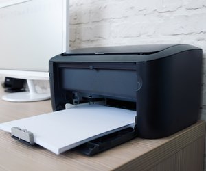 printer with paper on workplace