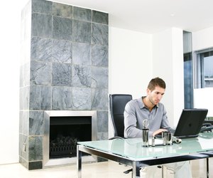 Man using laptop in home office