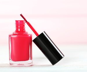Bottle of nail polish on a wooden table