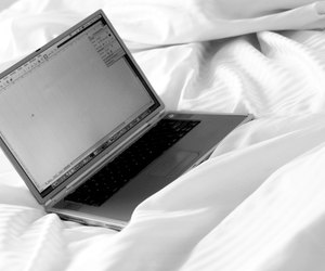 Laptop on a bed