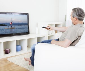 Mature man watching tv