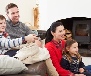 Family Relaxing Indoors Watching Television Together