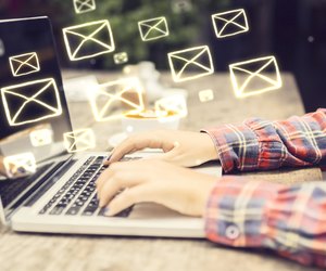 Email concept with laptop ang girl hands