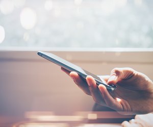 Mock up of man using smart phone in travel