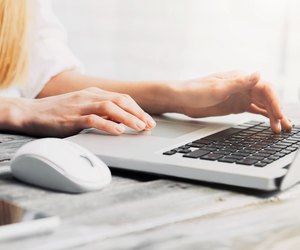 Ffemale hands on laptop keyboard