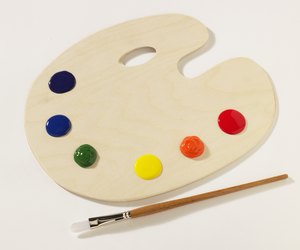 Paintbrush beside palette, elevated view