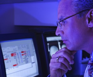 Technician using computer in laboratory