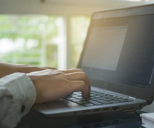 Close up hand type on keyboard labtop in home office