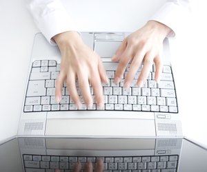 Person typing on laptop