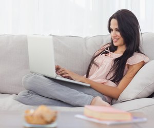 Attractive brunette using her laptop