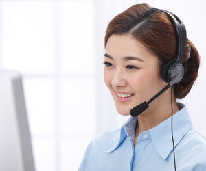 Young business lady wearing headset
