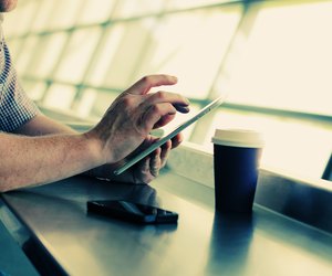 man's hands with tablet
