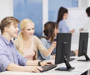 students with computer monitor at school
