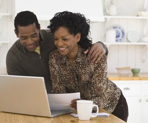 couple doing bills on computer