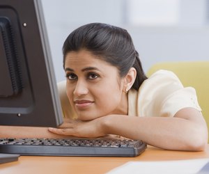 Indian businesswoman looking at laptop