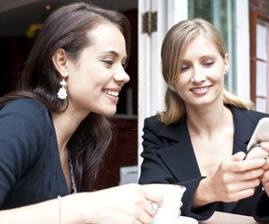 friends using smart phone at coffee shop