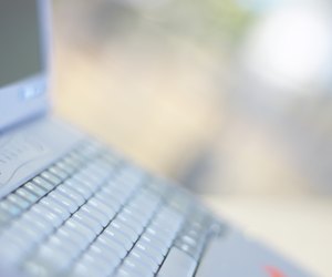 Cropped view of laptop computer outdoors