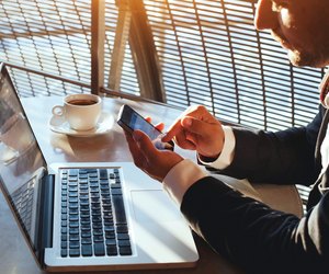 businessman checking email on smartphone