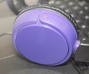 headphones on laptop keyboard