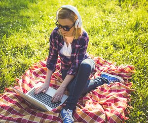 Girl with glasses using laptop