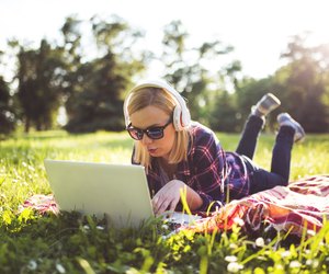 Woman listening to music at the park