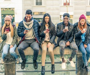 Multiracial group of people with cellphones