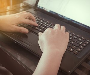 Close-up of typing female hands on keyboard