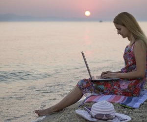 Woman chatting on beach at Sunrise