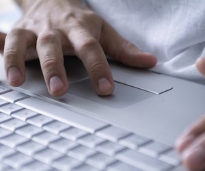 Human Hands operating a Laptop
