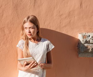 Elegant young woman using tablet