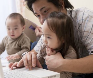Father and Daughter Looking at PC