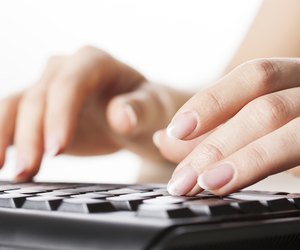 Hands writting on computer