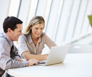 Business people Having Meeting Around Table In Modern Office