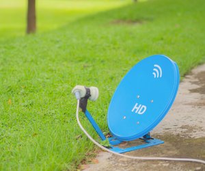 Blue Satellite is located on the cement floor.