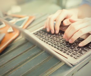 Hands typing on laptop - work anywhere concept (selective focus)