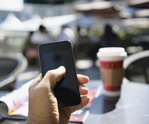 using mobile phone in a cafe