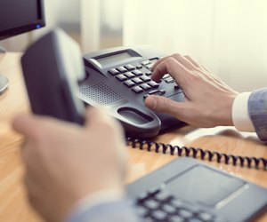 businessman dialing phone