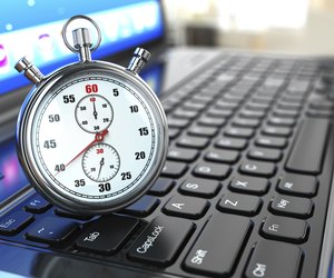 Stopwatch on laptop keyboard.