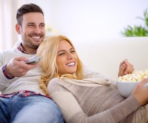 Couple at home watching TV