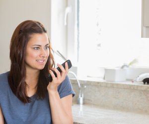 Brunette calling with her smartphone