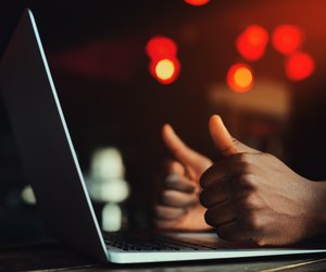 Black man's hands with thumbs up gesture. All is