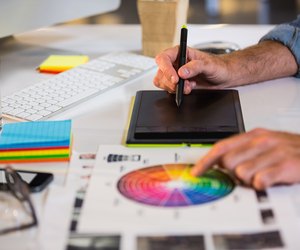 Businessman using graphics tablet in office