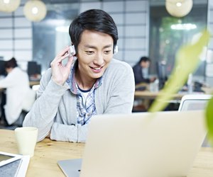 young asian designer working in office