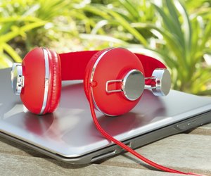 Vivid red headphones and laptop