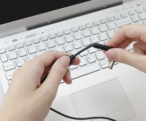 Broken charger cable in human hands