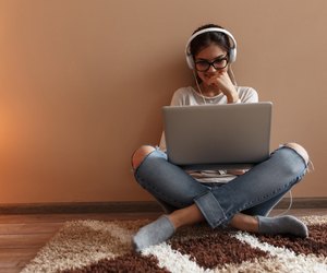 Young female blogger working at home