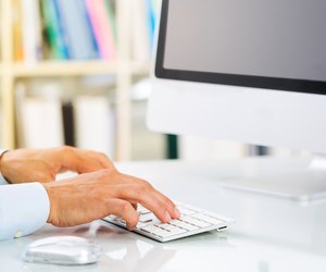 Businessman's Hands Typing on Keyboard